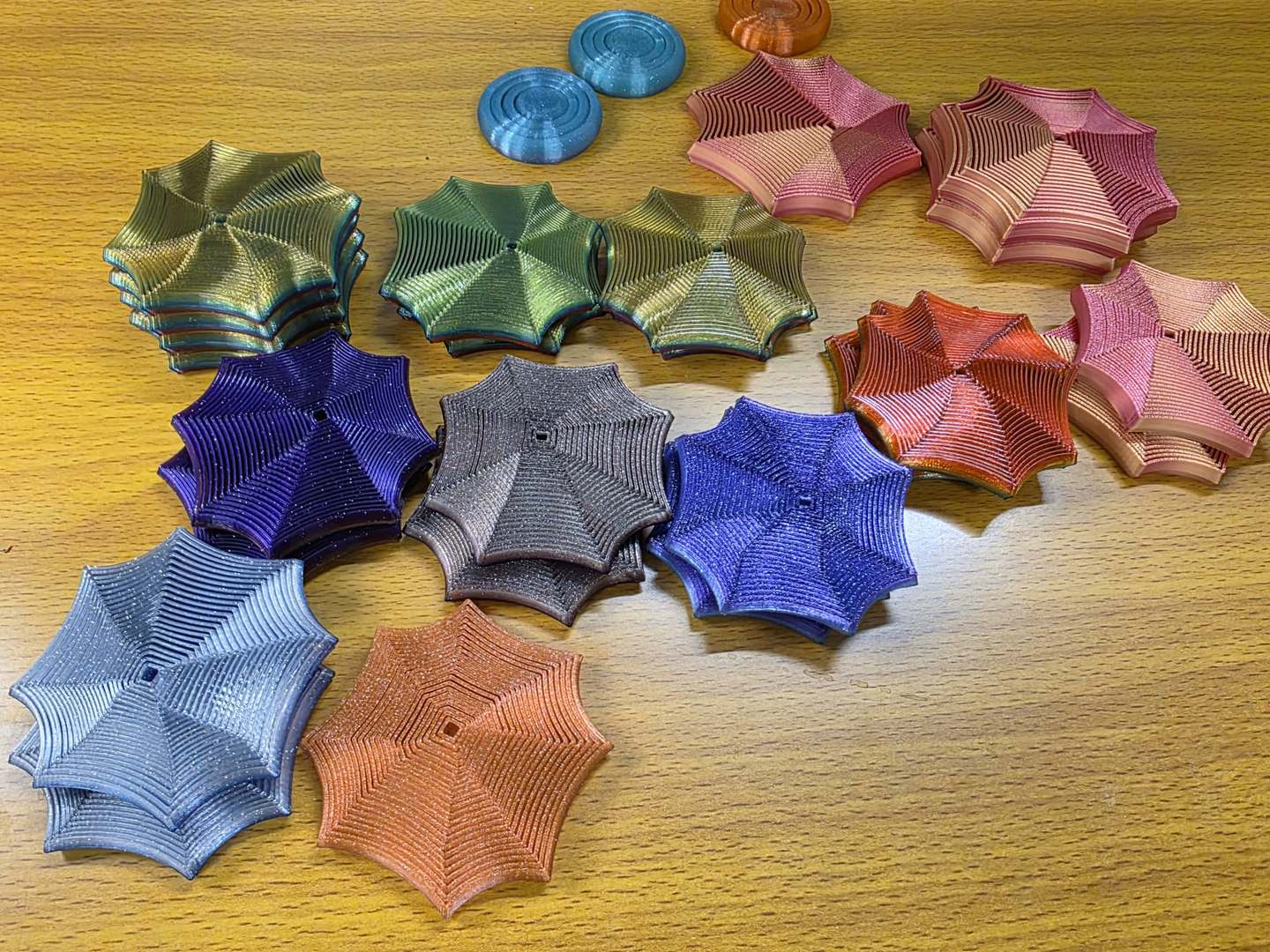 Focus Spirals in gold, green, coral, purple, blue and copper colourways on the studio bench