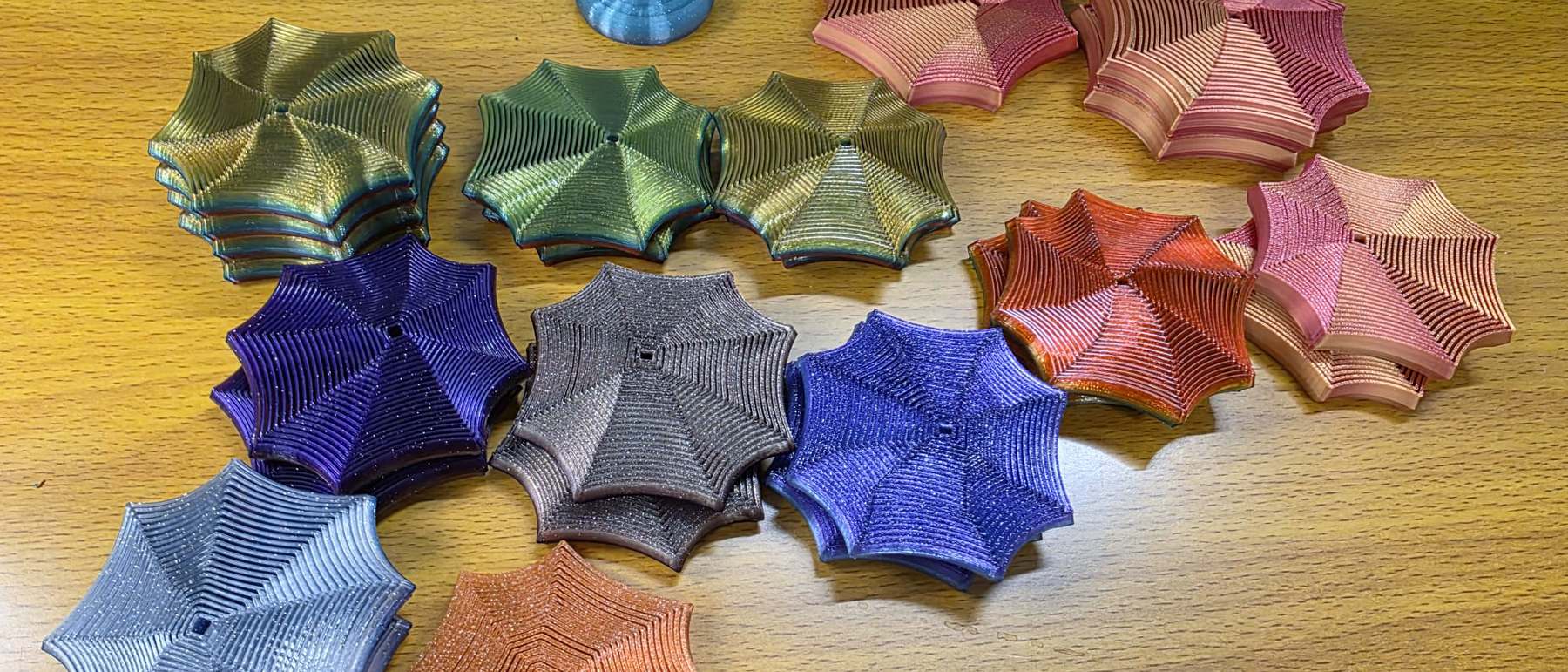 Finished Focus Spirals in glitter, rainbow, coral and copper colourways on the studio bench