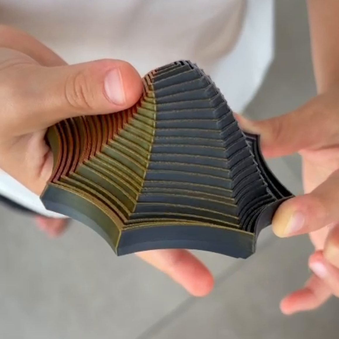 A Focus Spiral folded up into a cone in one hand