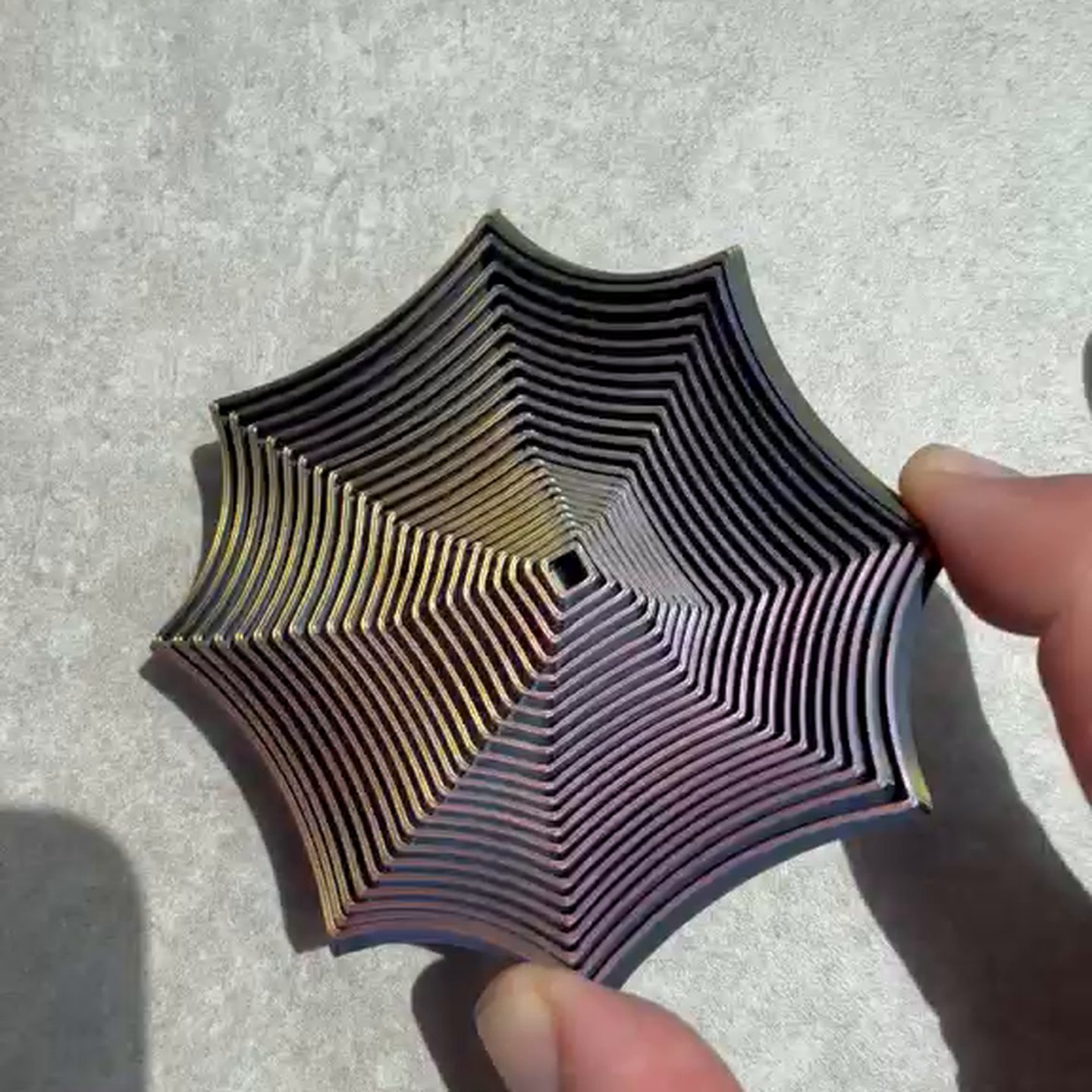 A Focus Spiral lying open flat in an adult hand