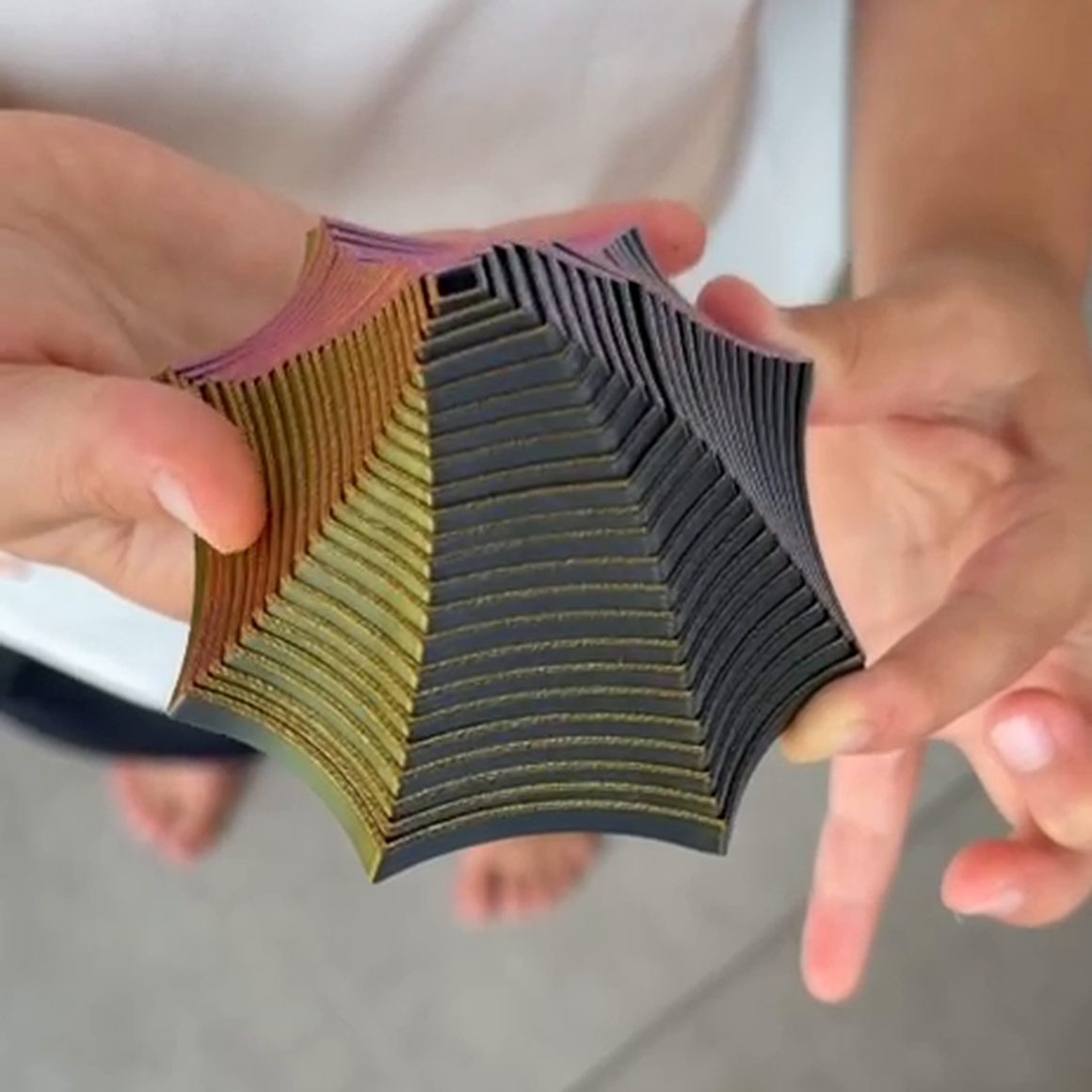A Focus Spiral being opened out again between two hands